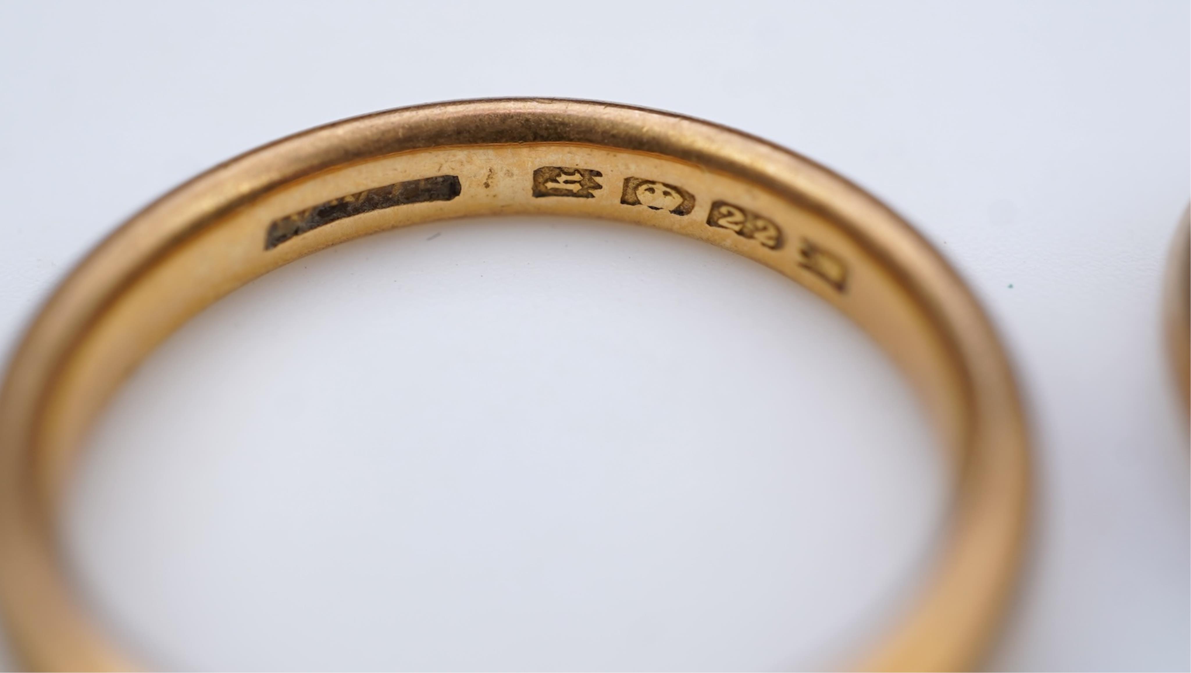A collection of six gold wedding bands